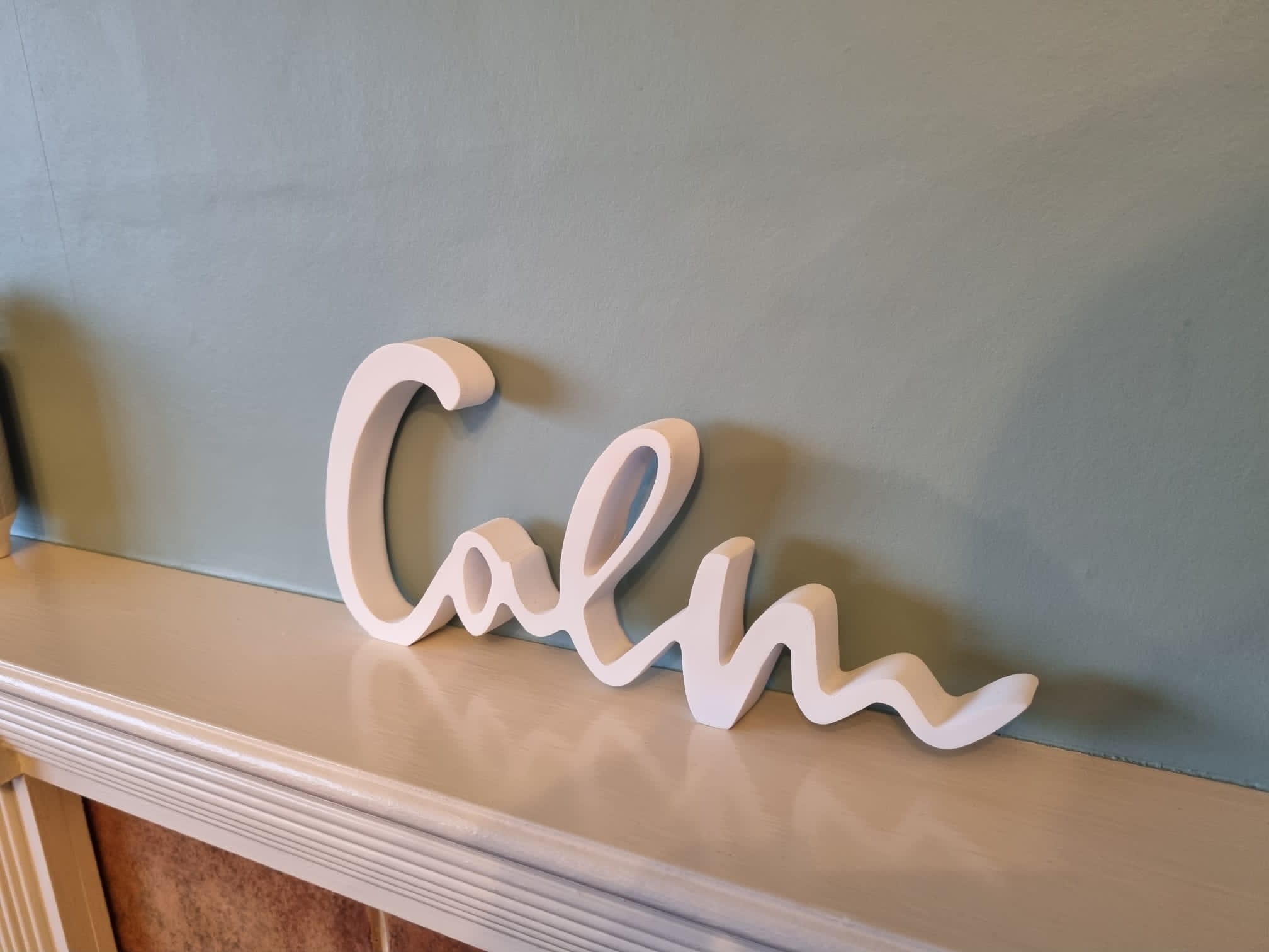 sculpture of the word calm in Millers cottage