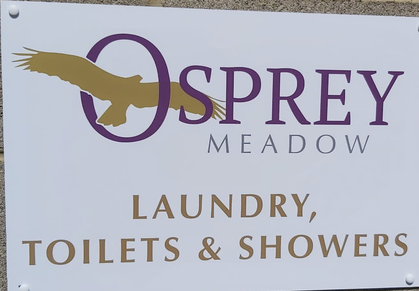 Osprey Meadow sign showing the laundry, toilets, and showers