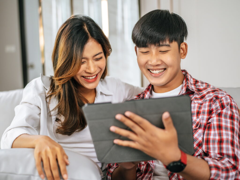 young couple using a tablet